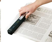 VuPoint Magic Wand scanning a newspaper
