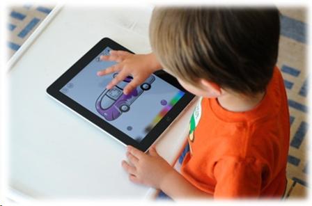 image of a child touching an iPad tablet.