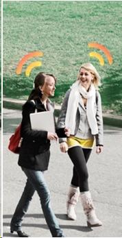 image of two college aged girls walking and talking