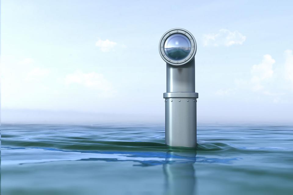 Periscope peering out of water.