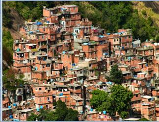 Picture 1 shows  "Rocinha" , a unfamous slum in Rio de Janeiro - Brazil . It shows shacks   cramped  on a hill. 