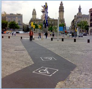 Picture 2 shows a square in Barcelona -  Spain, with  a well market path for  wheelchairs on the sidewalk. 